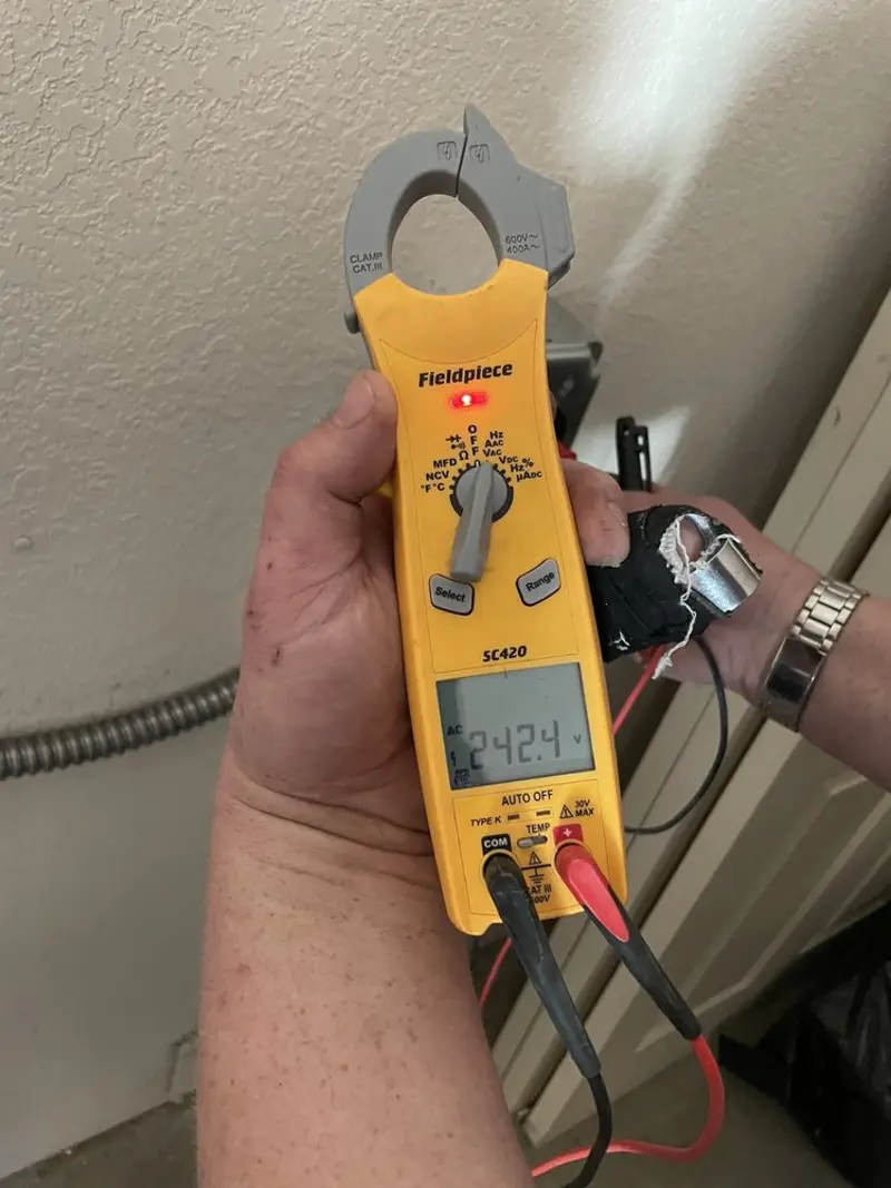 Voltage testing with clamp meter during Generator Installation in Benton Park